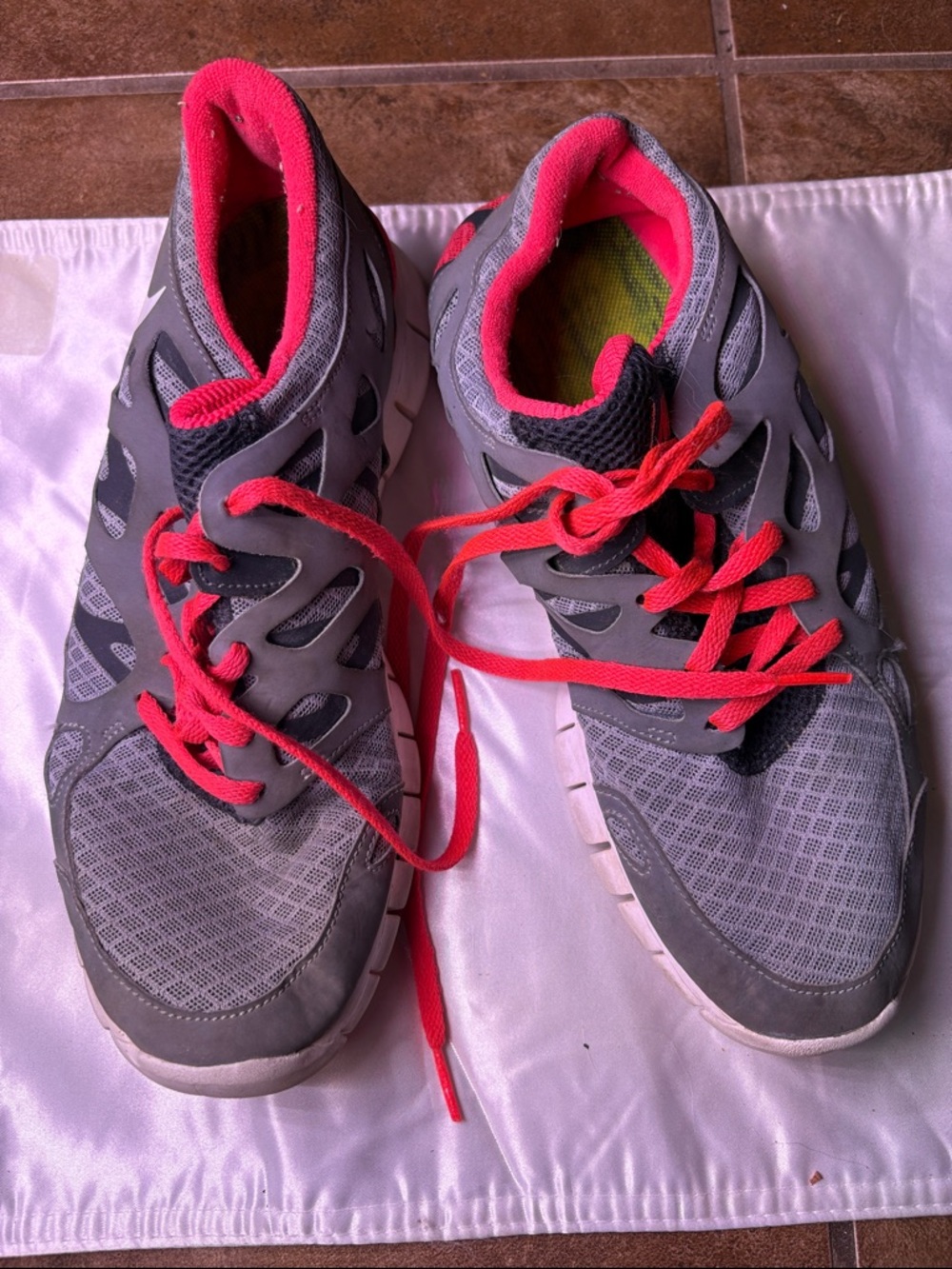 Nike Gray Athletic Shoes with Pink Accents